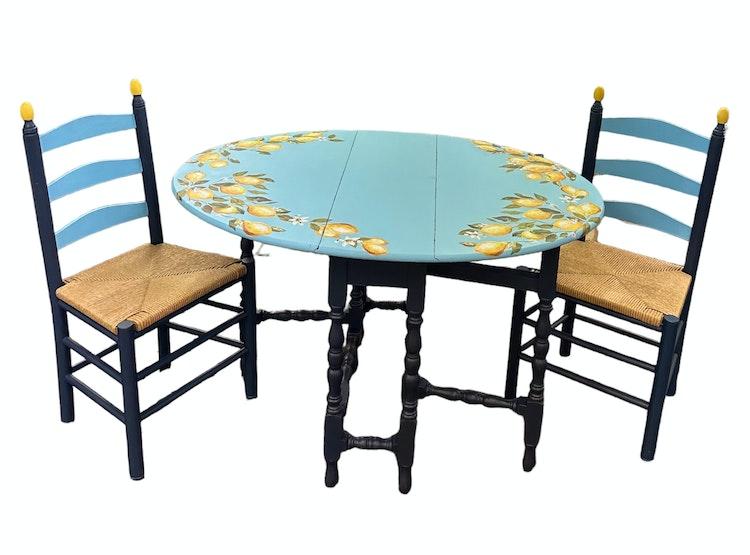 Limoncello Oval Gated Folding Table and two Chairs