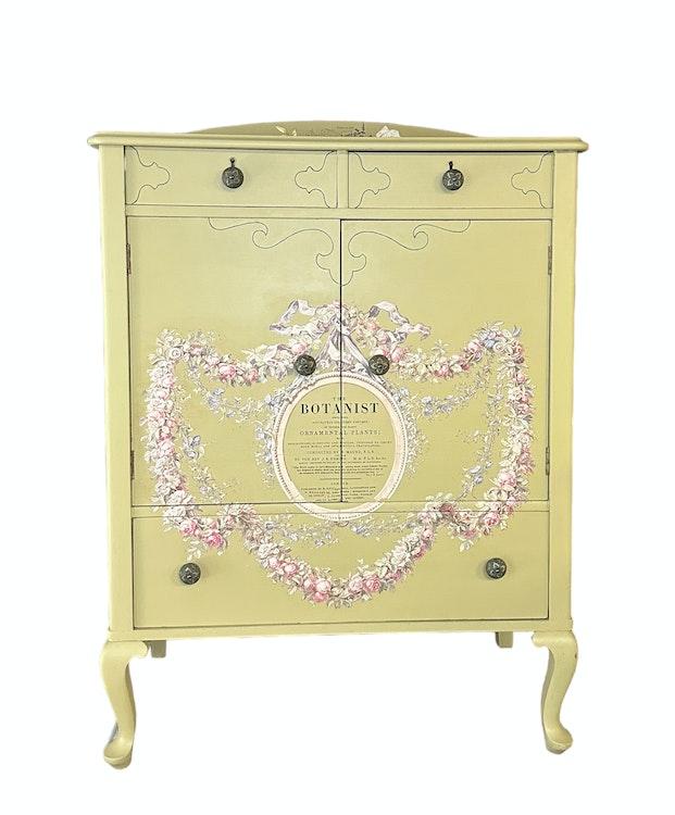 Olive colored dresser with floral botanist design